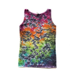 May include: A tie-dye tank top with a rainbow pattern in shades of pink, orange, yellow, green, blue, and purple. The tank top has a black background with white accents.
