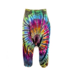May include: A pair of colorful tie-dye pants with a swirling pattern in shades of blue, green, pink, orange, and black.