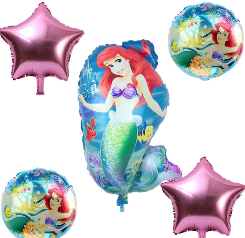 May include: A collection of foil balloons featuring the Little Mermaid, Ariel, in various shapes. The balloons include two star-shaped balloons in a metallic pink color and two round balloons with Ariel's image. The central balloon is Ariel-shaped.
