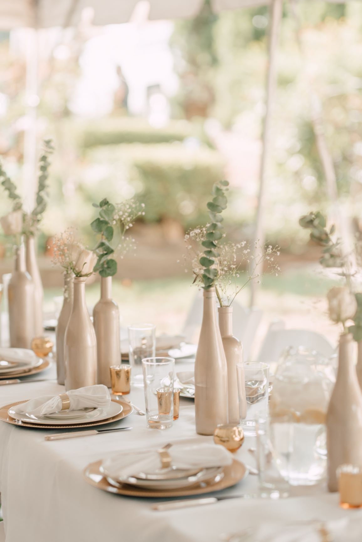 Black, white and gold party with glitter gold bottle centerpieces