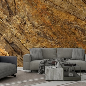 Steep golden brown stone cliffs, granite surface texture, stone patterned wallpaper