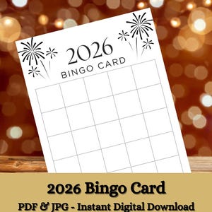 May include: A white 2026 Bingo Card with a grid of squares, black fireworks illustrations, and the text "2026 BINGO CARD". The card is set against a blurred background with bokeh lights and a wooden surface.
