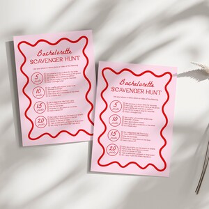 a pink paper with a red scalloped design on it