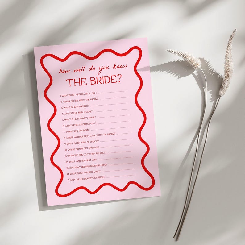 a pink paper with a red border on it
