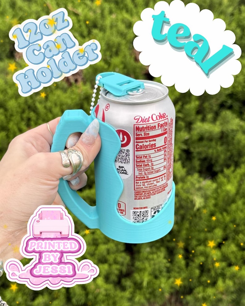 May include: A teal 12oz can holder with a handle and a top tab, holding a silver Diet Coke aluminum can. The text 12oz Can Holder and teal are visible in the image, along with a logo that reads Printed By Jessi in a pink graphic.