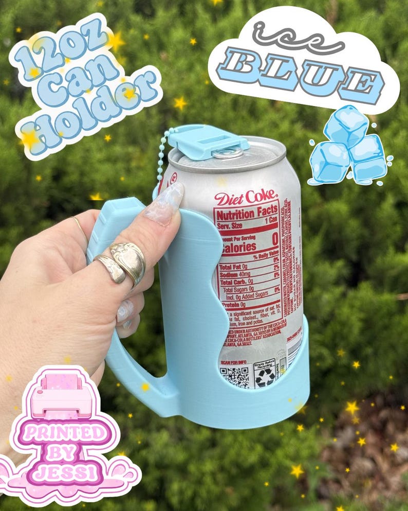 May include: A light blue plastic 12oz can holder with a handle and a top tab, holding a silver Diet Coke aluminum can. The holder features a small ball chain attachment. Text on the image includes 12oz Can Holder, ice BLUE, and PRINTED BY JESSI.