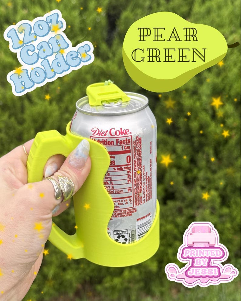 May include: A lime green 12oz can holder with a handle, holding a silver Diet Coke can. The text 12oz Can Holder and Pear Green are visible. A small graphic with the text Printed By Jessi is in the corner. The holder features a top tab.
