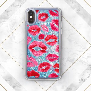 May include: A clear phone case with a glittery blue background and a pattern of red lips. The case is designed for an iPhone.