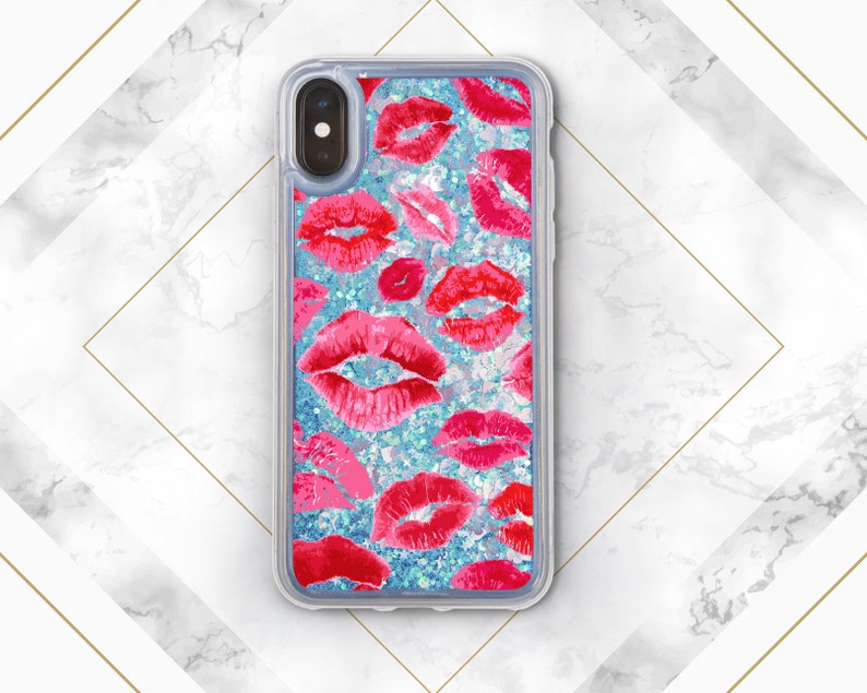 May include: A clear phone case with a glittery blue background and a pattern of red lips. The case is designed for an iPhone.