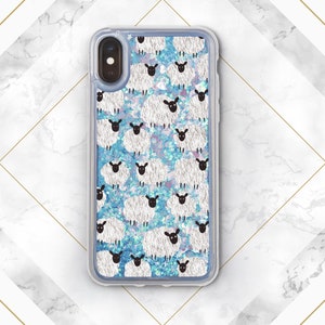 May include: A clear phone case with a blue and white glitter background and a repeating pattern of white sheep with black faces.