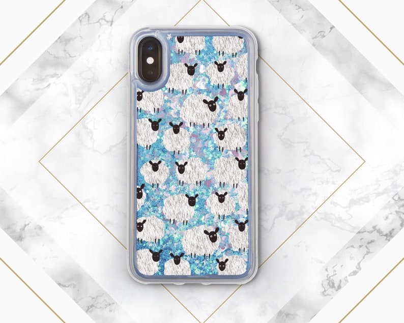 May include: A clear phone case with a blue and white glitter background and a repeating pattern of white sheep with black faces.