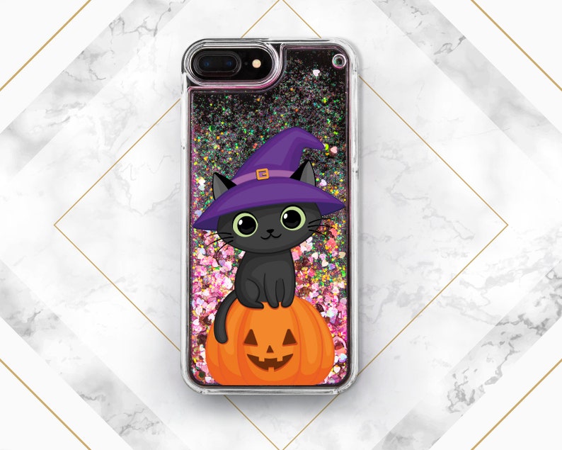 May include: A black cat wearing a purple witch hat sits on top of an orange pumpkin with a jack-o'-lantern face. The image is inside a clear phone case with glitter.