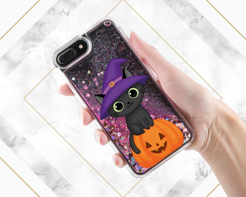 May include: A clear phone case with a black cat wearing a purple witch hat and sitting on a pumpkin. The case is filled with pink and silver glitter.