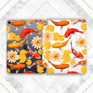 May include: Two iPad cases with a koi fish and lily pad pattern. One case is black with white lily pads and the other is white with yellow lily pads.