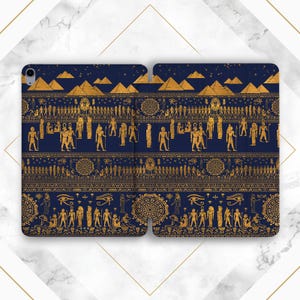May include: Navy blue tablet case featuring a gold Egyptian design. The design includes pyramids, hieroglyphs, and figures. The case is open, revealing the interior. The overall theme is ancient Egypt.