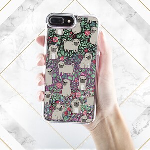 May include: A clear phone case with a glittery background and a repeating pattern of pugs and flowers. The pugs are brown and white and the flowers are pink, red, and green.