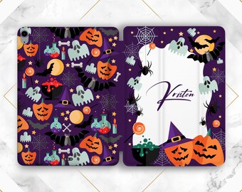 May include: A purple Halloween-themed tablet case featuring jack-o'-lanterns, ghosts, bats, spiders, and potion bottles. The case has a repeating pattern on the left side and a personalized name on the right side. The design includes a full moon and spiderwebs.