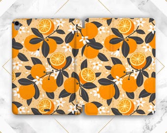 May include: A tablet case with a pattern of orange slices and leaves on a light orange background. The case is made of a durable material and has a sleek design.