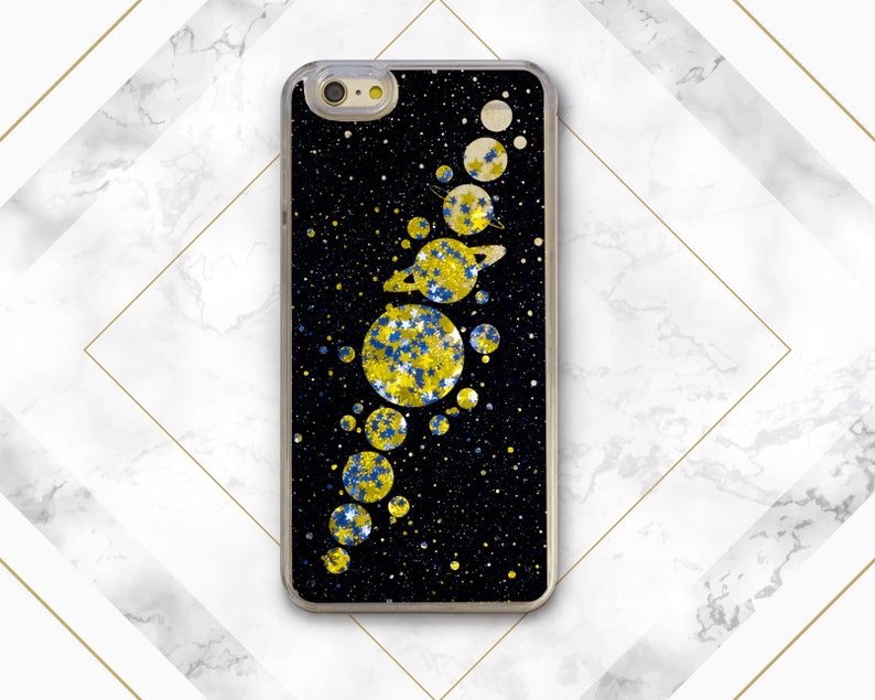 May include: A black phone case with a glitter design of a solar system. The planets are yellow and blue with glitter accents. The background is black with a subtle glitter effect.