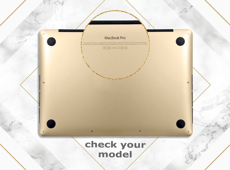 May include: Gold-coloured MacBook Pro laptop with the text "MacBook Pro" and FCC and CE markings on the back.
