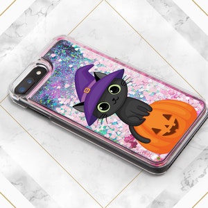 May include: A black glitter phone case with a black cat wearing a purple witch hat and holding a jack-o'-lantern. The case has a pink and white glitter background.