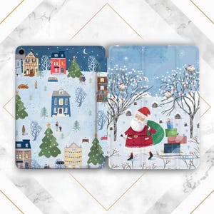May include: A two-piece tablet case featuring a winter village scene with houses, trees, and people. The second panel shows Santa Claus carrying a sack of gifts in a snowy landscape. The case has a blue background.