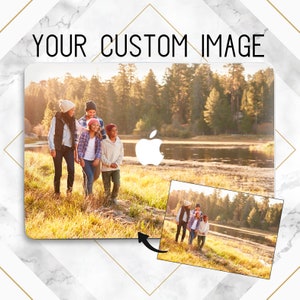 May include: A family of five walks along a path in a grassy field near a lake. The sun shines brightly, casting long shadows. The image is a photo of a family walking in a park.