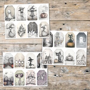 May include: A collection of Halloween-themed gift tags with whimsical illustrations in shades of gray and purple. The tags feature images of ghosts, witches, pumpkins, haunted houses, and bats, perfect for adding a spooky touch to gifts.