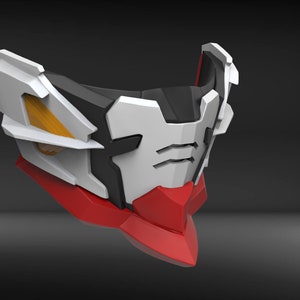 May include: A white, black and red plastic mask with a geometric design. The mask has a sharp, angular shape and features a small, rectangular opening for the eyes.