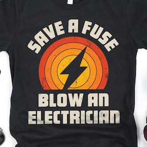 May include: Black t-shirt with a retro-style graphic that says "Save a Fuse Blow an Electrician". The graphic features a lightning bolt and a sunset.
