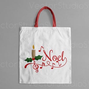 May include: A white tote bag with red handles features a Christmas-themed design. The design includes a candle, holly, and musical notes with the word "Noel" in red cursive.