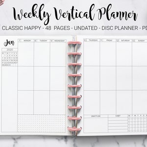 May include: A weekly vertical planner with a pink and white color scheme. The planner is undated and has 48 pages. The planner has a calendar for January 2020, a weekly spread, a gratitude section, a habit tracker, and a daily habit tracker.