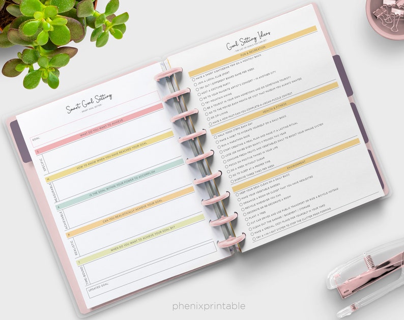 May include: A printable planner page with a pink, yellow, and green color scheme. The page is titled "Smart Goal Setting" and includes sections for goal, specific, measurable, achievable, relevant, and time-bound. The page also includes a section titled "Goal Setting Ideas" with suggestions for personal growth and development.