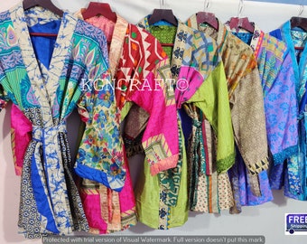May include: A collection of six colorful silk robes with different patterns and designs. The robes are hanging on hangers and have a tie belt. The robes are made of recycled saris and are a unique and stylish way to add a touch of bohemian chic to your wardrobe.