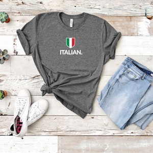 May include: A grey t-shirt with a white Italian flag design and the word "ITALIAN." printed on the front.