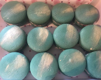 Homemade green macarons with gold  decoration