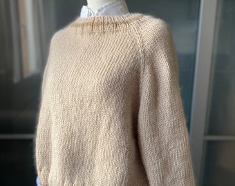 Handmade knitted sweater with sleeves in 100% natural fine wool fiber