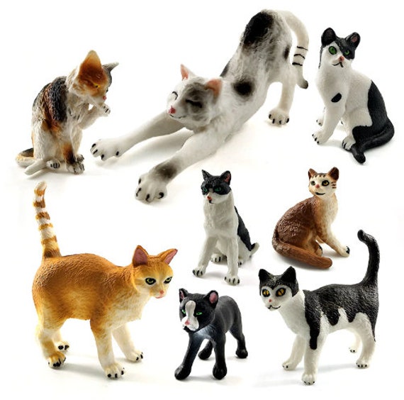 small plastic cat figures