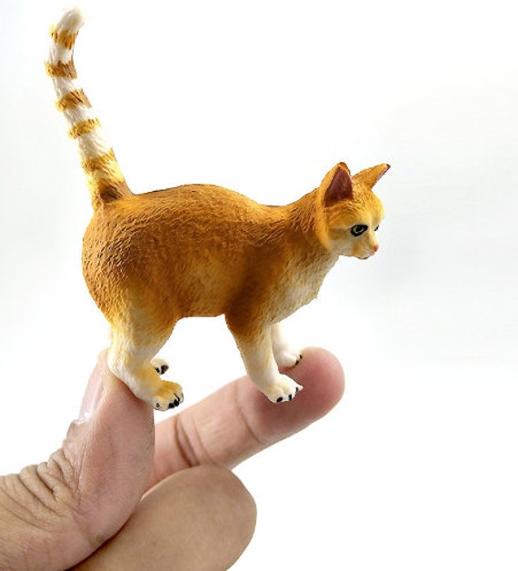 small plastic cat figures