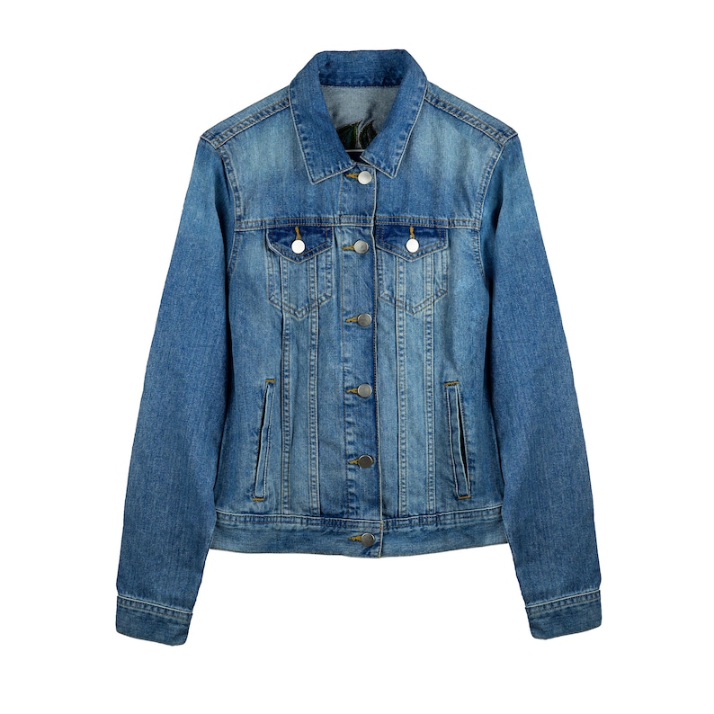 May include: A classic blue denim jacket with a button-up front and two chest pockets.