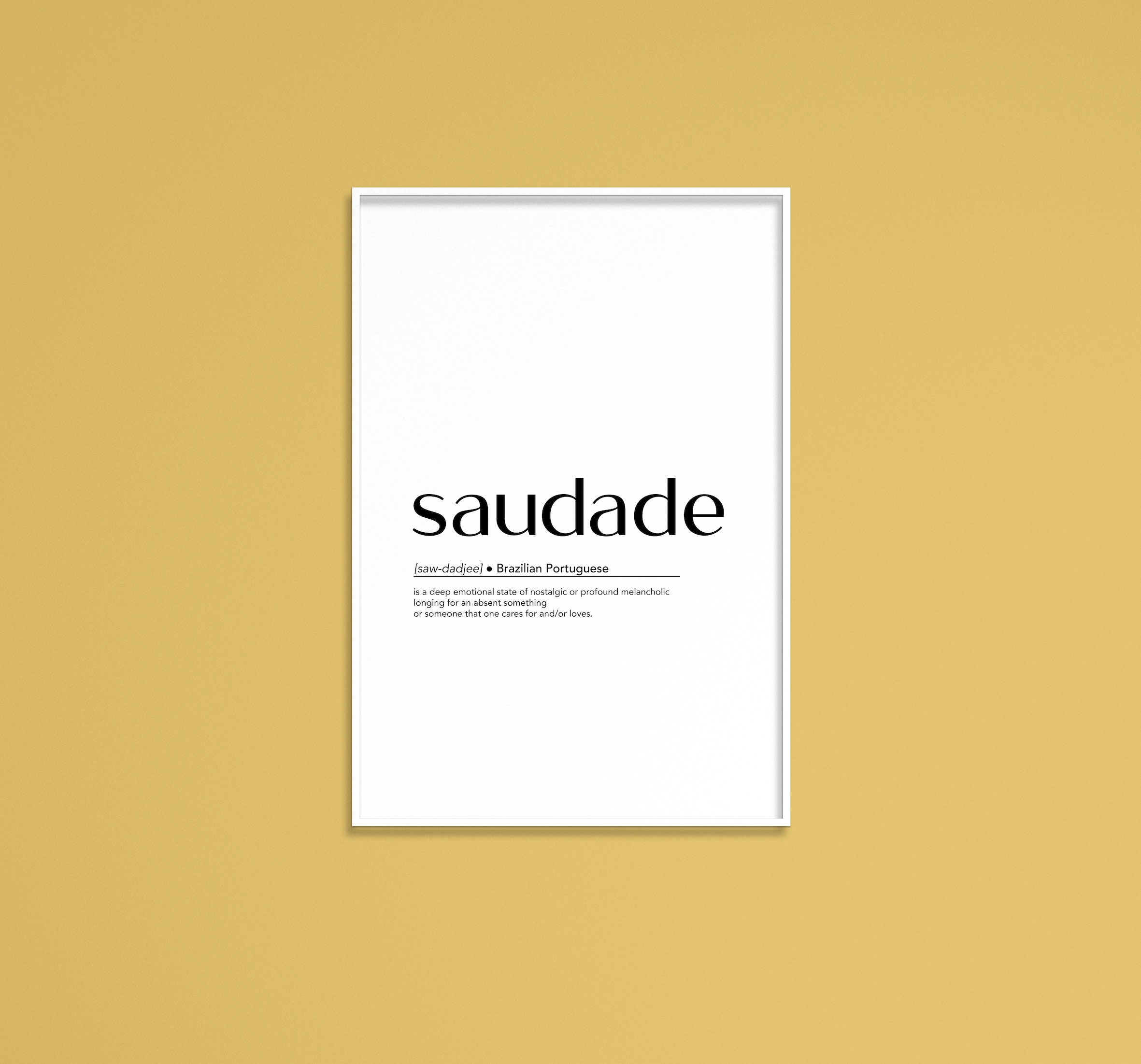 Saudade, Portuguese word meaning nostalgia or longing composed with yellow  colored stone letters over green sand Stock Photo - Alamy