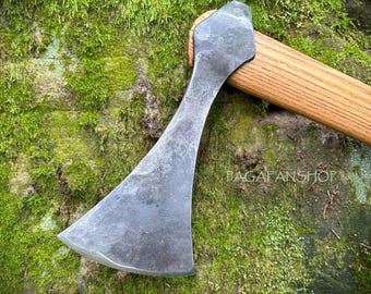 May include: A hand-forged axe with a wooden handle. The axe head is made of steel and has a curved blade. The handle is made of wood and has a natural finish.
