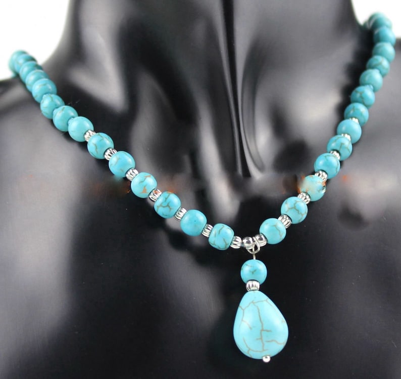 199 Turquoise necklace is 18 inches long and has 8 mm beads with a pendant of turquoise