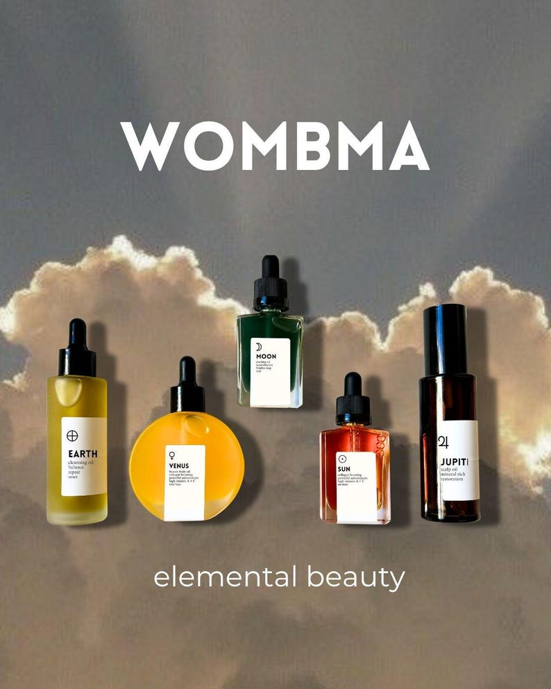 May include: A collection of six glass bottles with black droppers, each containing a different colored liquid. The bottles are labeled "EARTH", "VENUS", "MOON", "SUN", and "JUPITI". The text "WOMBA" and "elemental beauty" are also displayed.