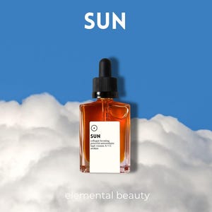May include: A square amber-colored glass bottle with a black dropper top. The bottle has a white label with the word "SUN" and other text. The background is a blue sky with white clouds. The words "elemental beauty" are at the bottom.