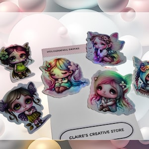 May include: A set of six holographic fairy stickers with colourful wings and hair. The stickers feature a variety of fairy designs, including a fairy with green wings and a fairy with rainbow wings. The stickers are labelled "Holographic Fairies" and "Claire's Creative Store".