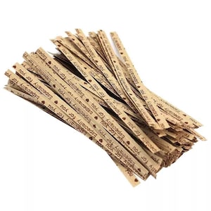 May include: A pile of brown paper twist ties with the text "Especially for you" printed in brown on them. The twist ties are decorated with small red hearts.