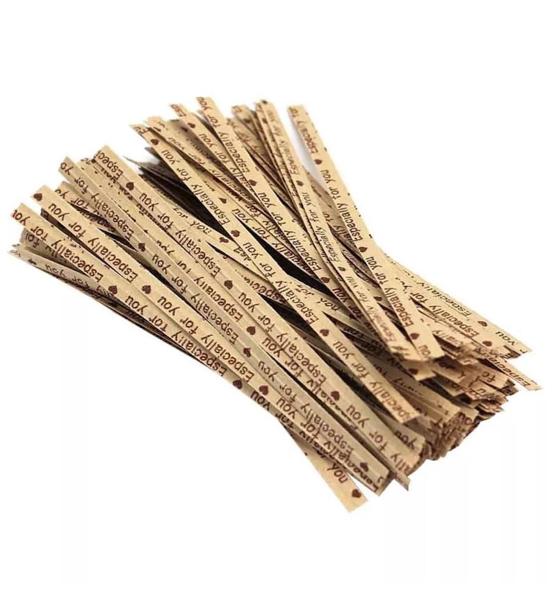 May include: A pile of brown paper twist ties with the text "Especially for you" printed in brown on them. The twist ties are decorated with small red hearts.
