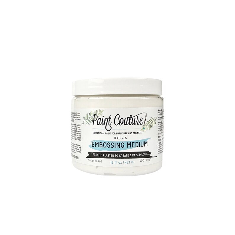 May include: A white jar of Paint Couture Embossing Medium, a water-based acrylic plaster to create a raised look. The jar is labeled with the brand name, product name, and size: 16 fl oz / 473 ml.