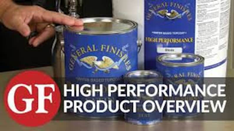 May include: A set of General Finishes High Performance water-based polyurethane paint cans in various sizes. The cans are blue with a white eagle logo and the text "General Finishes" and "High Performance" printed on them. The largest can is labeled "Black".